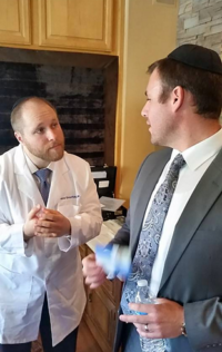Rabbi Katz explaining the process before the circumcision.