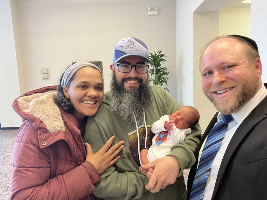 Happy family after Rabbi Katz performed their son's circumcision.